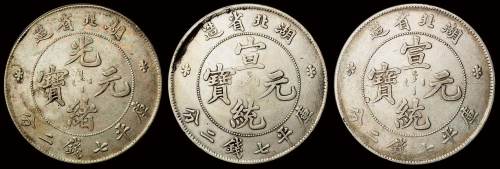 1895年湖北省造光绪元宝库平七钱二分银币一枚，近未使用品；1909年湖北省造宣统元宝库平七钱二分银币二枚，计三枚，极美品