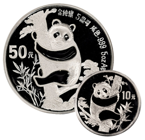 1987年熊猫纪念银币二枚，均精制，其中一枚面值50元，重量5盎司，另一枚面值10元，重量1盎司，成色均为99.9%，附原盒及证书