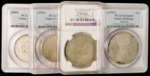 新疆银币一组四枚，分别为：1905年饷银五钱一枚，PCGS XF45；民国元年饷银伍钱背壬子双旗一枚，PCGS F15；民国六年饷银一两背壬子双旗一枚，PCGS Genuine；民国六年迪化银圆局造一