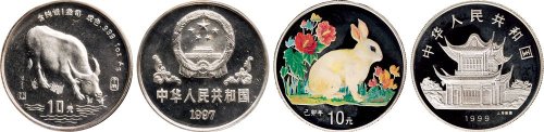 1997年中国人民银行发行丁丑（牛）年生肖纪念银币、1999年中国人民银行发行己卯（兔）年彩色生肖纪念银币各一枚