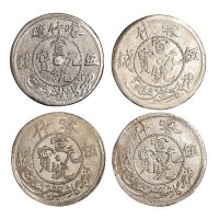 1909－1911年喀什造宣统元宝、宣统银币五钱一组十五枚，计喀什宣统元宝“五”钱四枚；喀什宣统元宝“伍”钱六枚；喀什宣统银币五枚