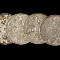 1900年庚子、1908年戊申吉林省造光绪元宝中心“2”库平一钱四分四厘银币各一枚；1905年乙巳吉林省造光绪元宝库平一钱四分四厘银币二枚，计四枚，近未使用品