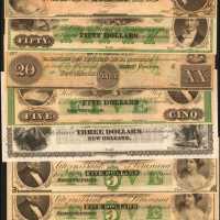 Lot of (9) Obsolete Banknotes from Louisiana. Fine to Gem Uncirculated.