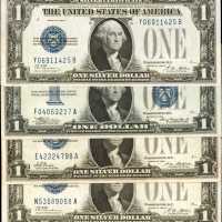 Lot of (4) $1 Silver Certificates. Very Fine to Gem Uncirculated.