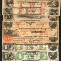 Lot of (13) Obsolete Notes from Nebraska. Very Fine to Choice Uncirculated.