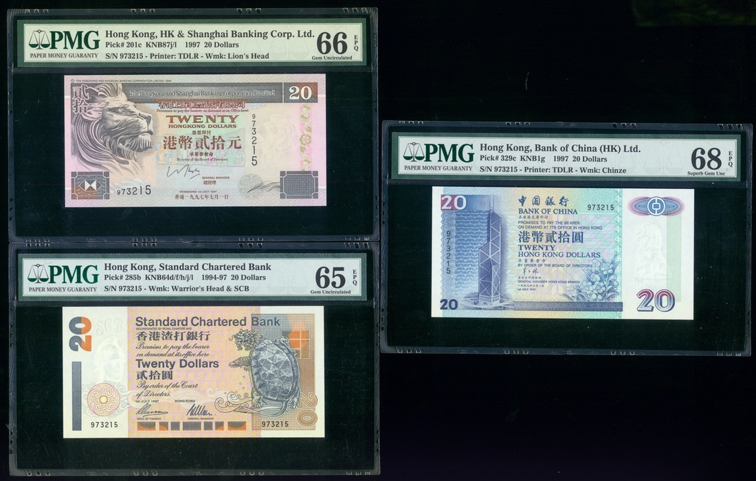1997年纪念中华人民共和国香港特别行政区成立$20三枚，包括汇丰银行、渣打银行及中国银行，相同编号973215，无字冠，连原装书册，分别评PMG 66EPQ, 65EPQ及68EPQ。Hong Ko